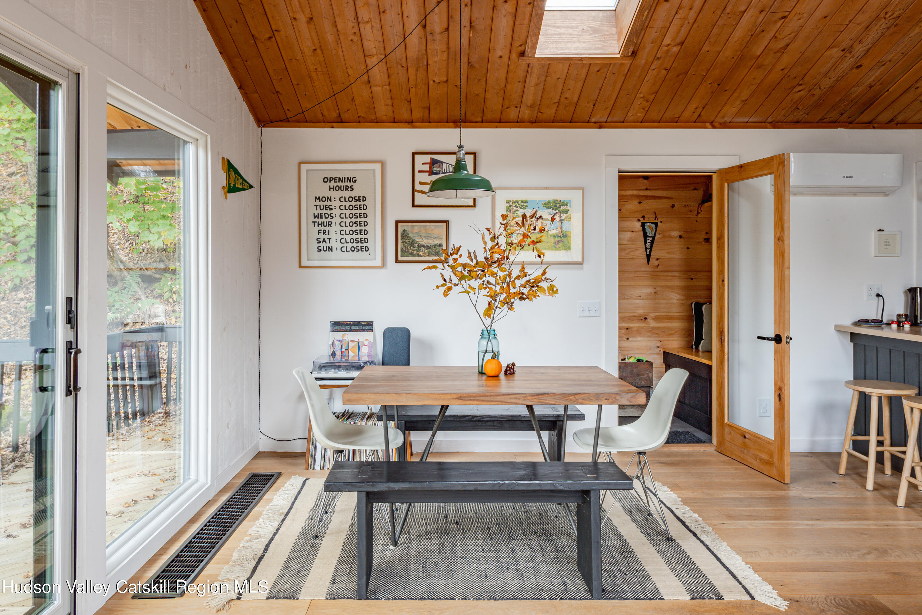 167 Pine Lane Hunter, NY 12442 - Photo 14 of 27 a view of a dining room with furniture window and wooden floor