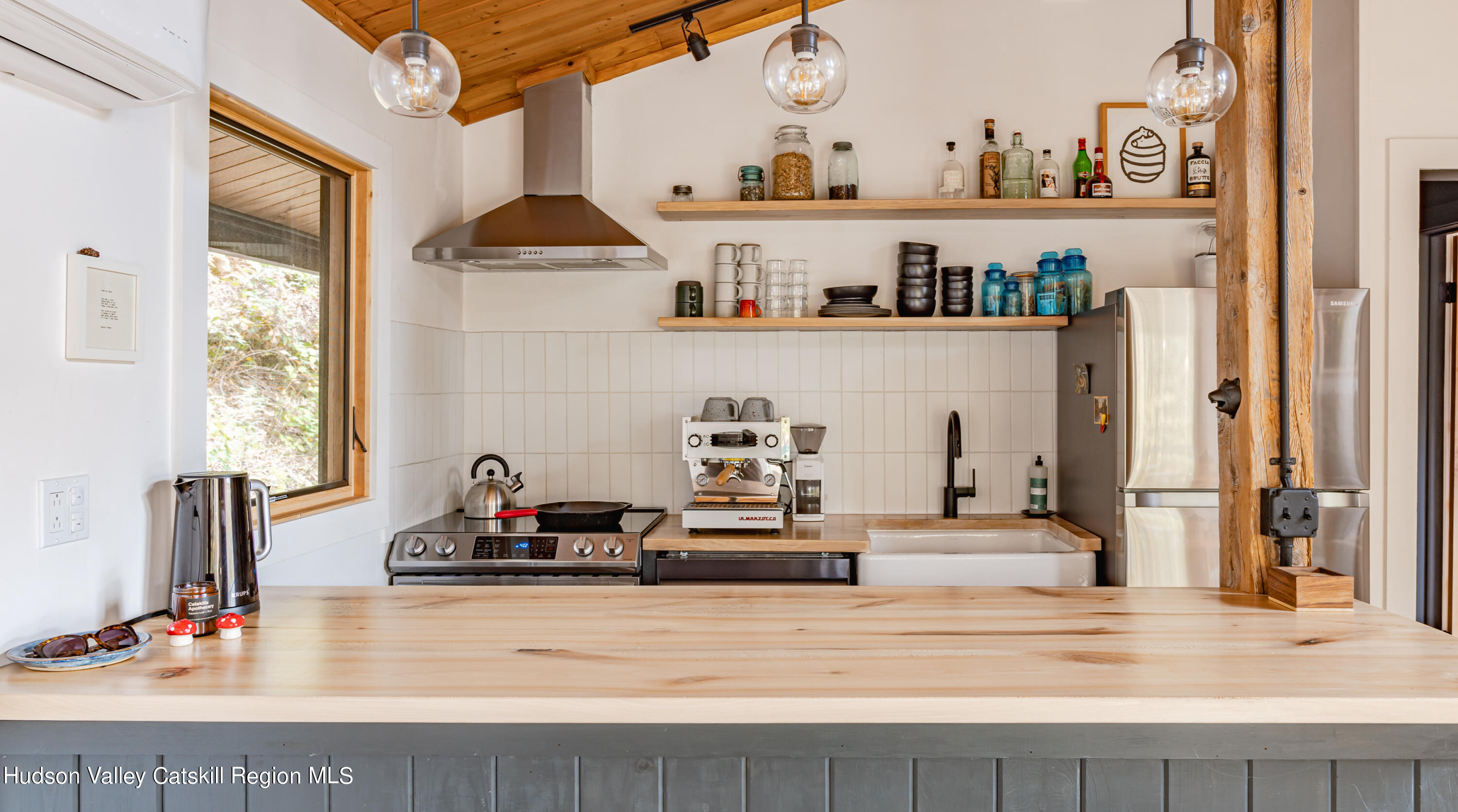 167 Pine Lane Hunter, NY 12442 - Photo 16 of 27 a living room with hard wood floor and gym equipment