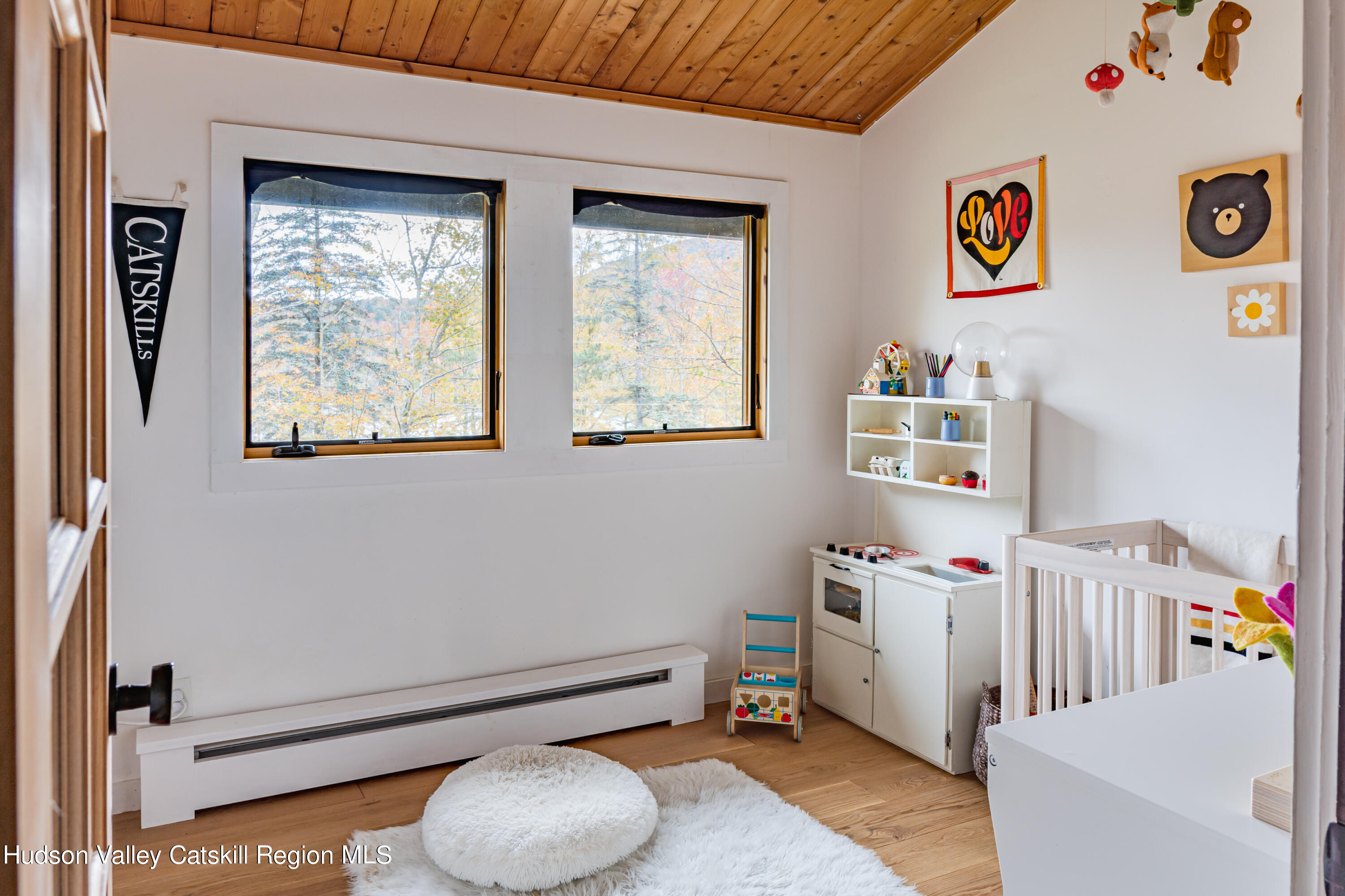 167 Pine Lane Hunter, NY 12442 - Photo 17 of 27 a bedroom with furniture and a window