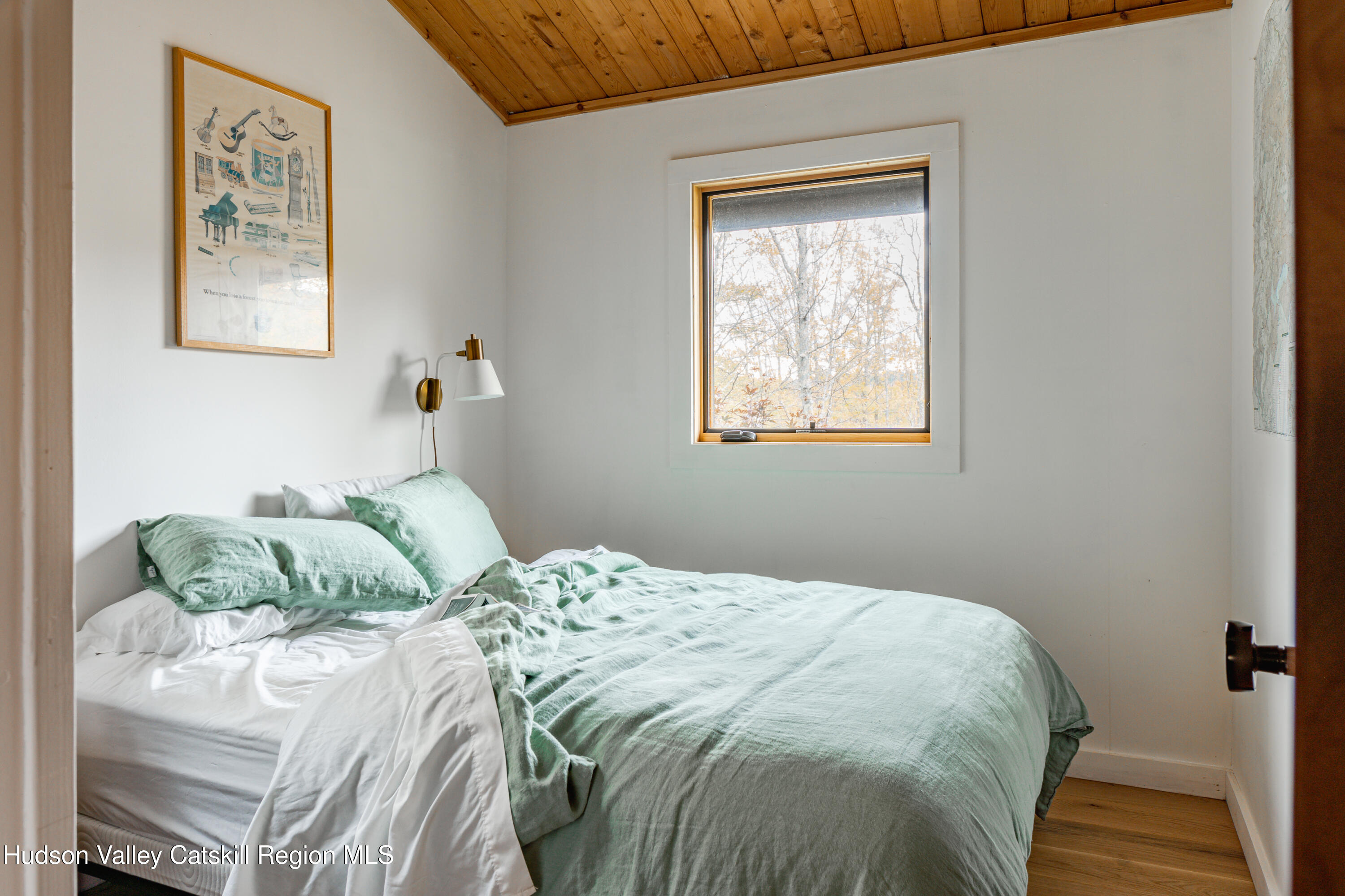 167 Pine Lane Hunter, NY 12442 - Photo 21 of 27 a bedroom with a bed and a window