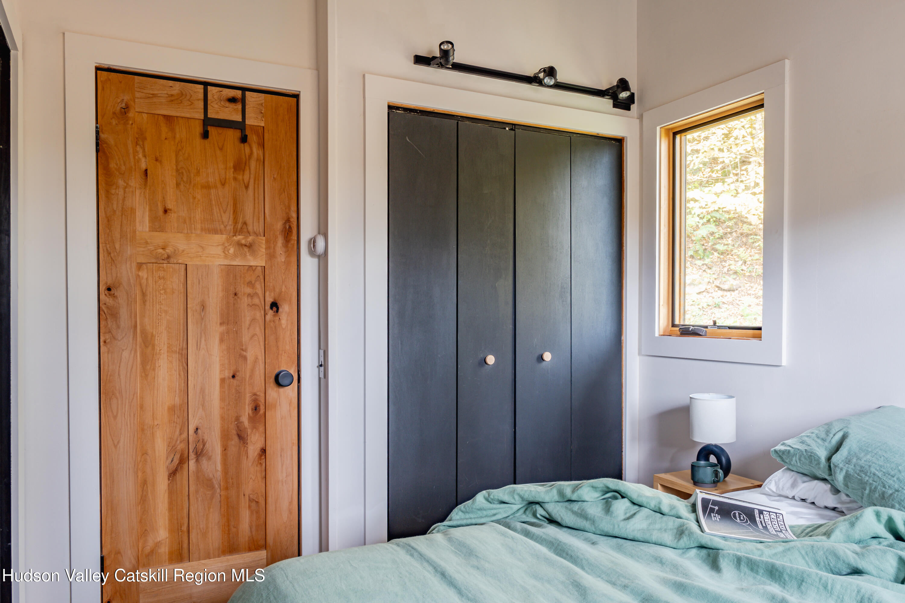 167 Pine Lane Hunter, NY 12442 - Photo 23 of 27 a bedroom with a bed and a window