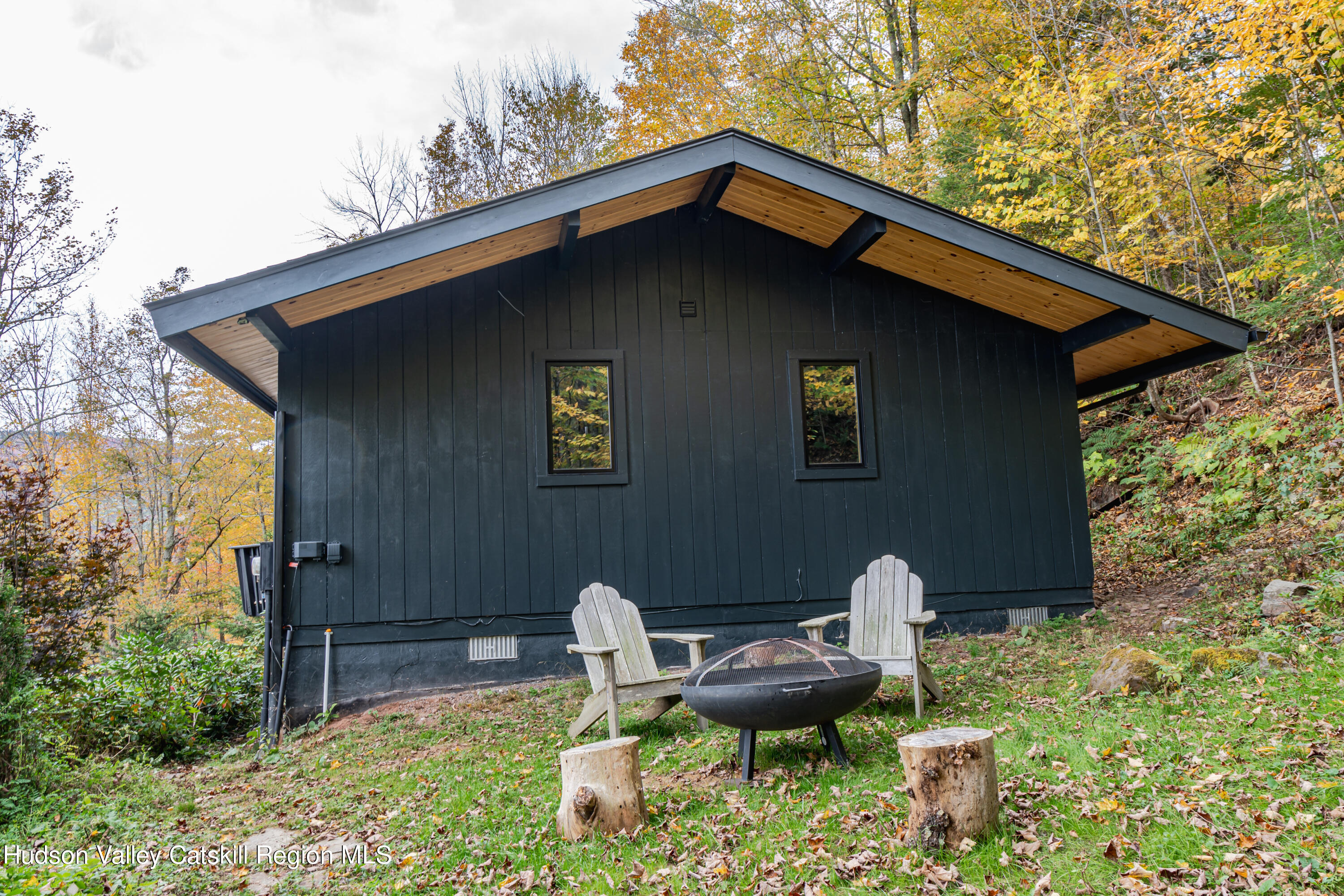 167 Pine Lane Hunter, NY 12442 - Photo 10 of 27 a backyard of a house with outdoor seating