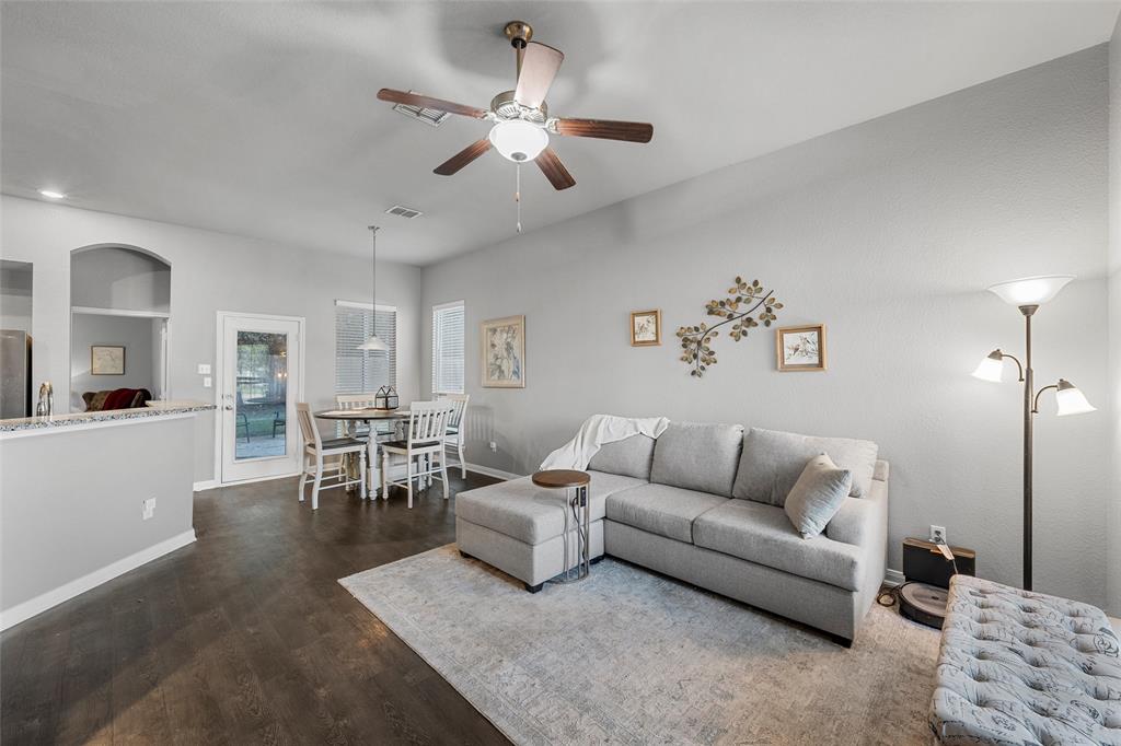 1214 Merganser Way Waco, TX 76706 - Photo 2 of 14 a living room with furniture kitchen view and a chandelier