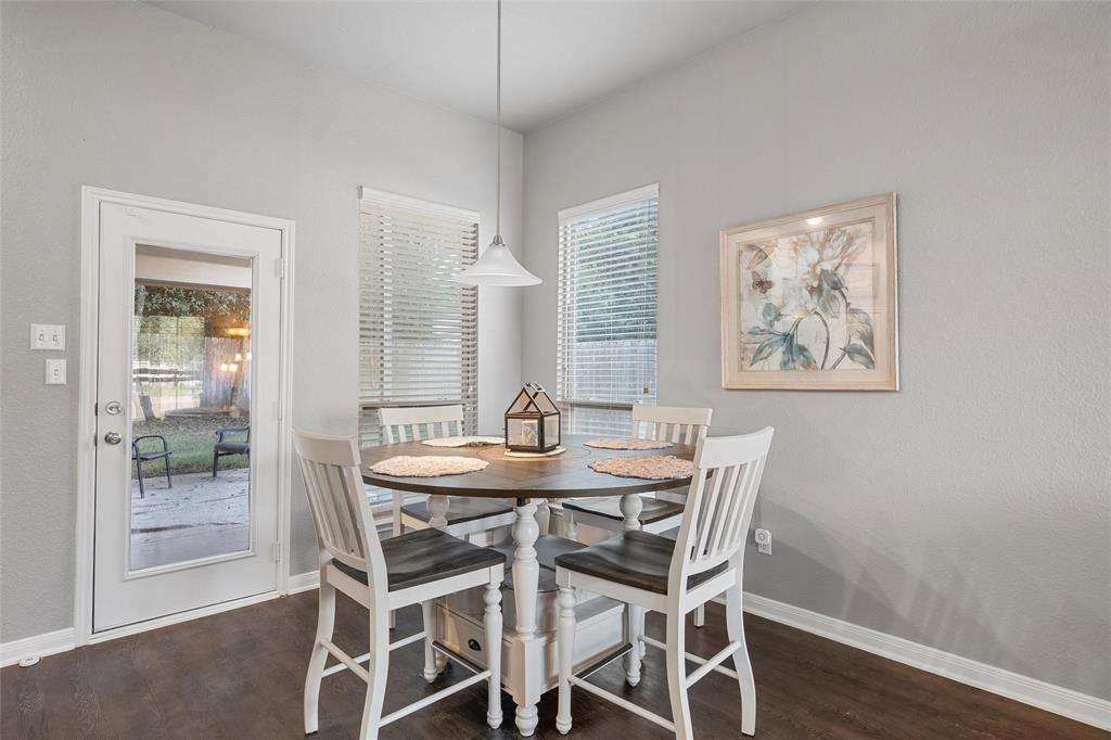 1214 Merganser Way Waco, TX 76706 - Photo 4 of 14 a view of a dining room with furniture and wooden floor