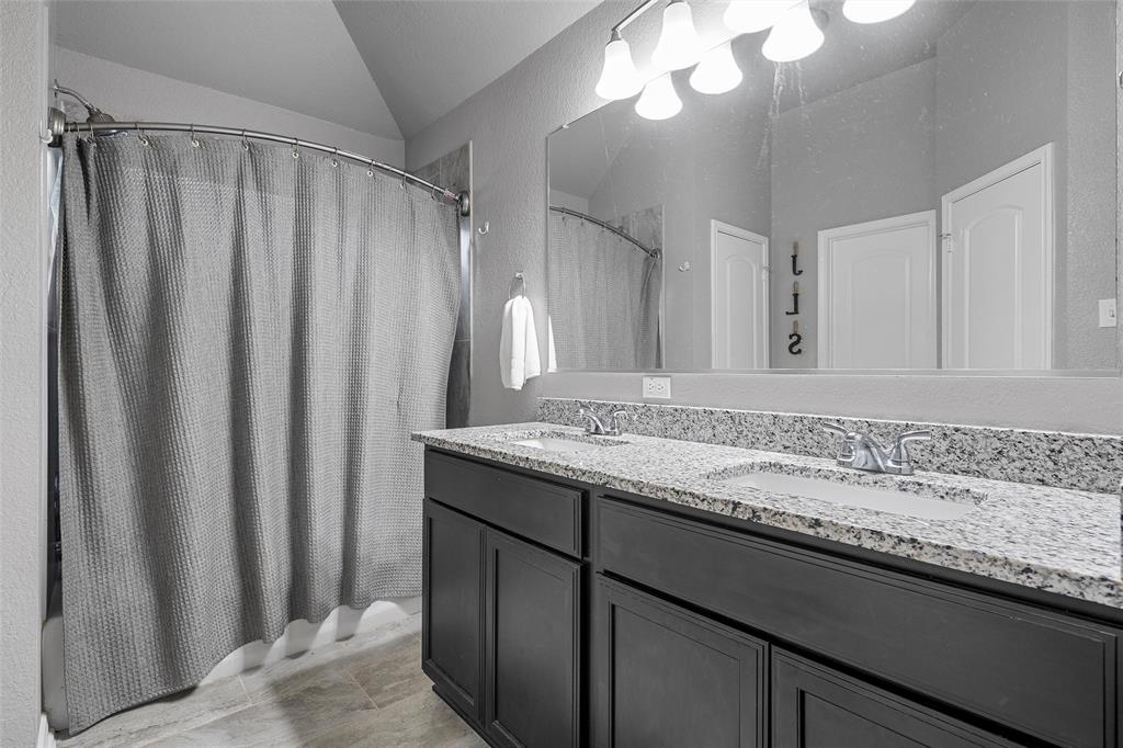 1214 Merganser Way Waco, TX 76706 - Photo 8 of 14 a bathroom with a granite countertop sink and a mirror