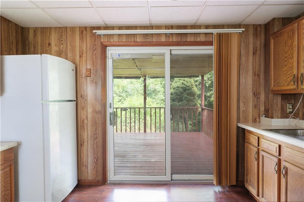 118 Klein Road Clairton, PA 15025 - Photo 29 of 39 a kitchen with a refrigerator a sink and cabinets