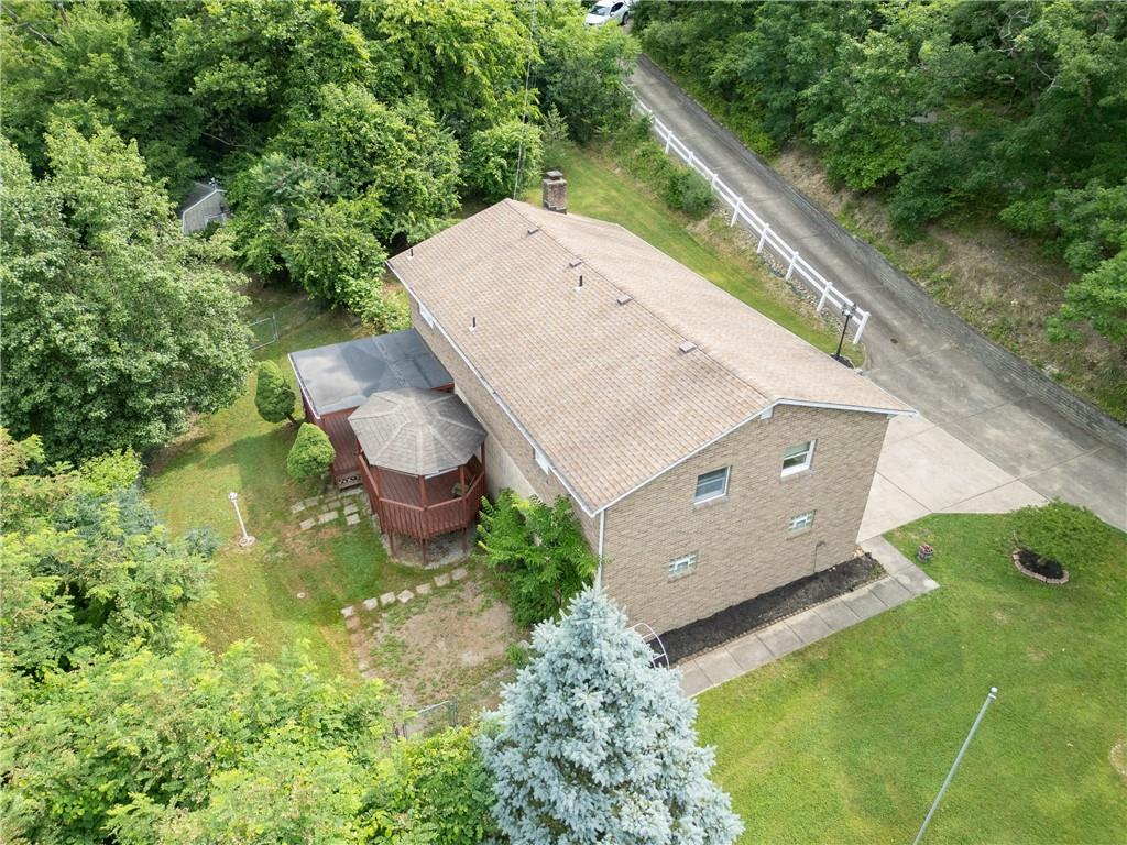 118 Klein Road Clairton, PA 15025 - Photo 3 of 39 a view of a backyard with chairs and a potted plant