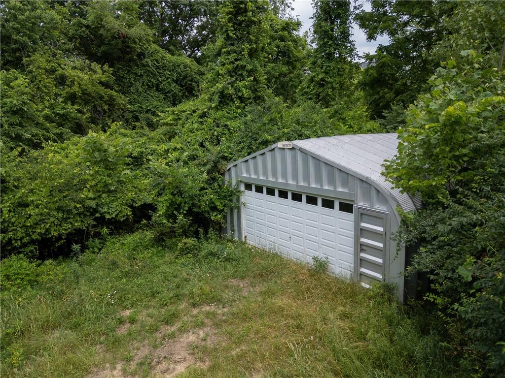 118 Klein Road Clairton, PA 15025 - Photo 35 of 39 a view of a house with a small yard and large trees