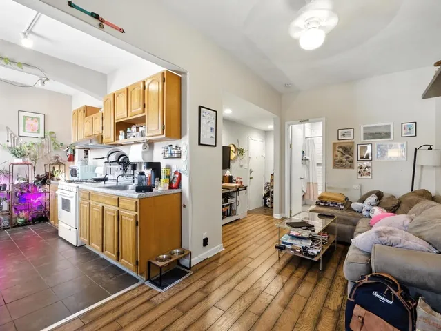 a kitchen with stainless steel appliances granite countertop a stove and a refrigerator