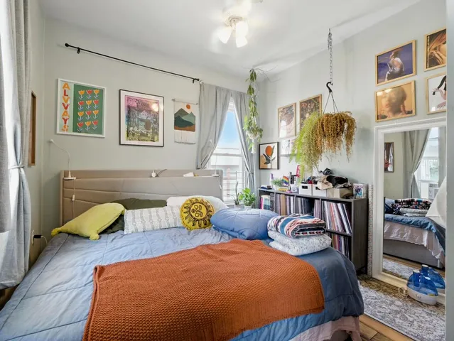 a bathroom with a sink a toilet and shower curtain