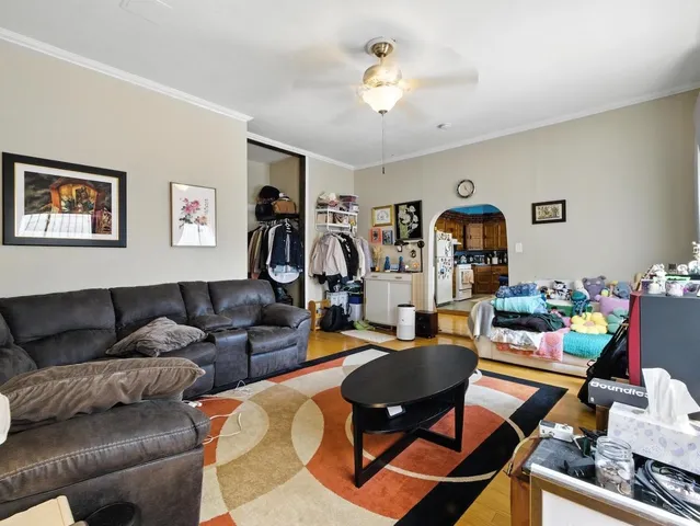 a work room with furniture and a flat screen tv
