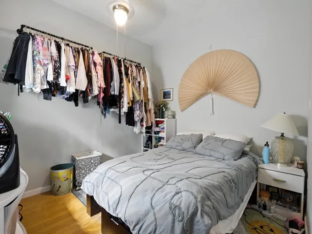 a picture of a building with a white sign on the side