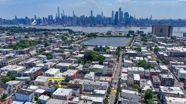 an aerial view of residential houses with outdoor space