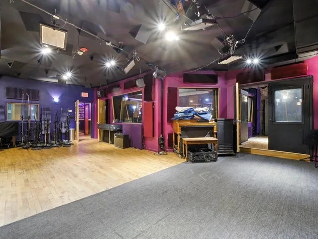 a room with wooden floor and furniture