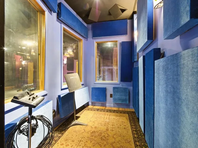 a work room with furniture and a window