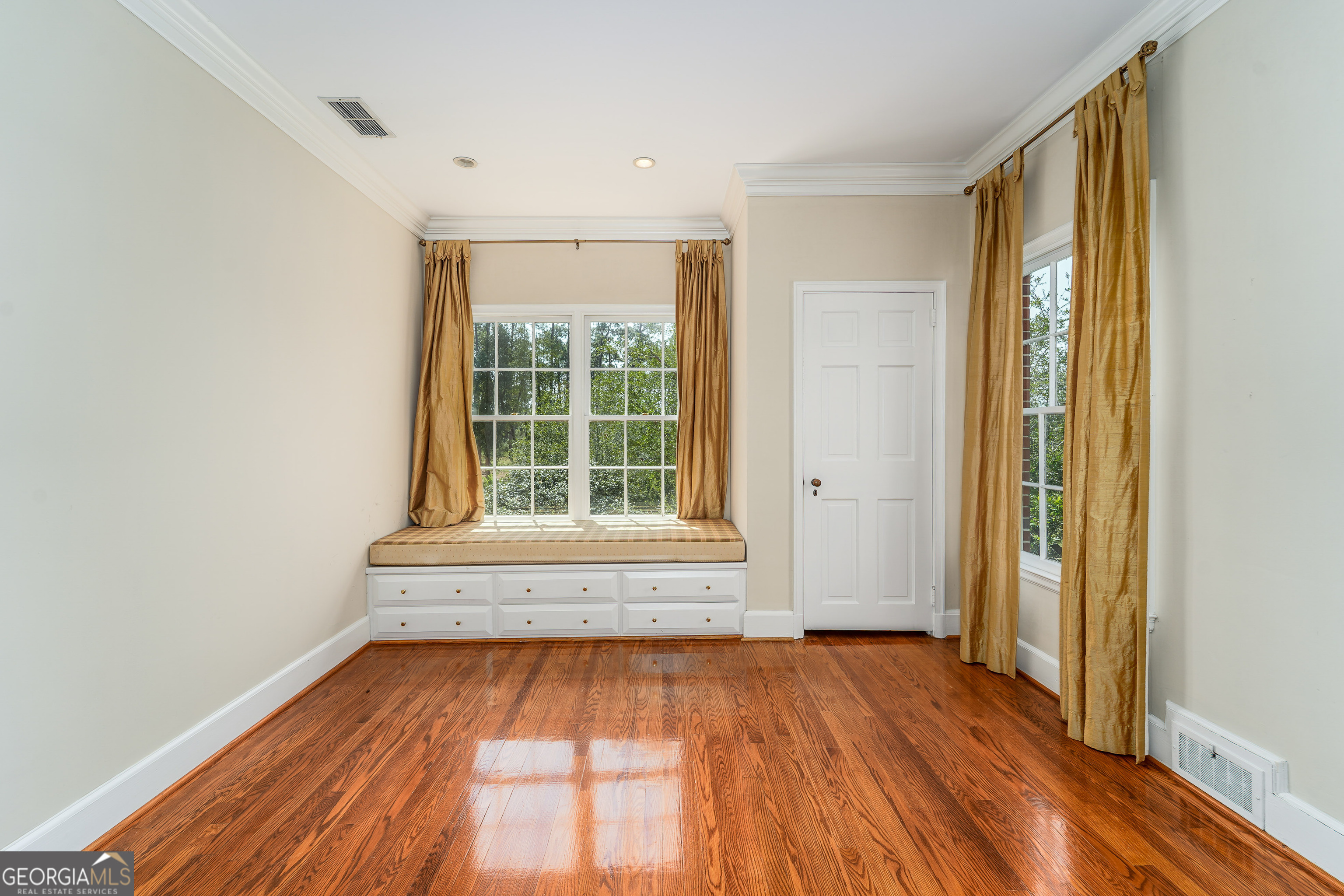 1602 Ward St Extension West Douglas, GA 31533 - Photo 52 of 70 a view of an empty room with wooden floor and a window