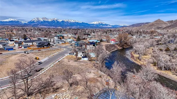 a view of a backyard with wooden fence