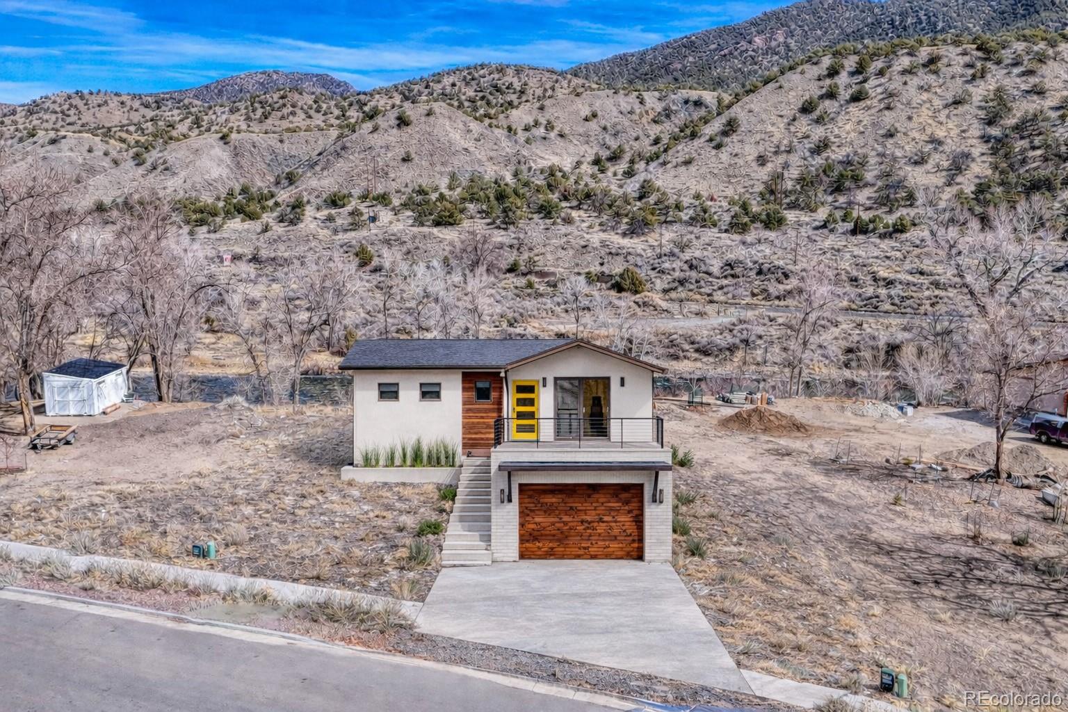 257 River Ridge Lane Salida, CO 81201 - Photo 2 of 18 a front view of a house with a yard
