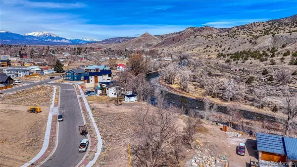 a view of a yard with mountains in the background