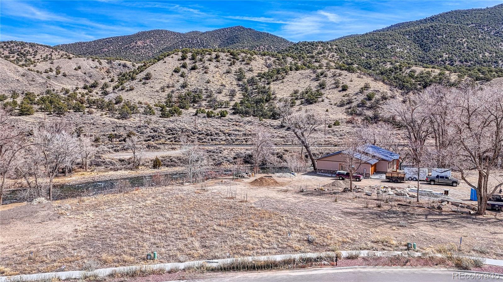 257 River Ridge Lane Salida, CO 81201 - Photo 6 of 18 a view of a yard with mountains in the background