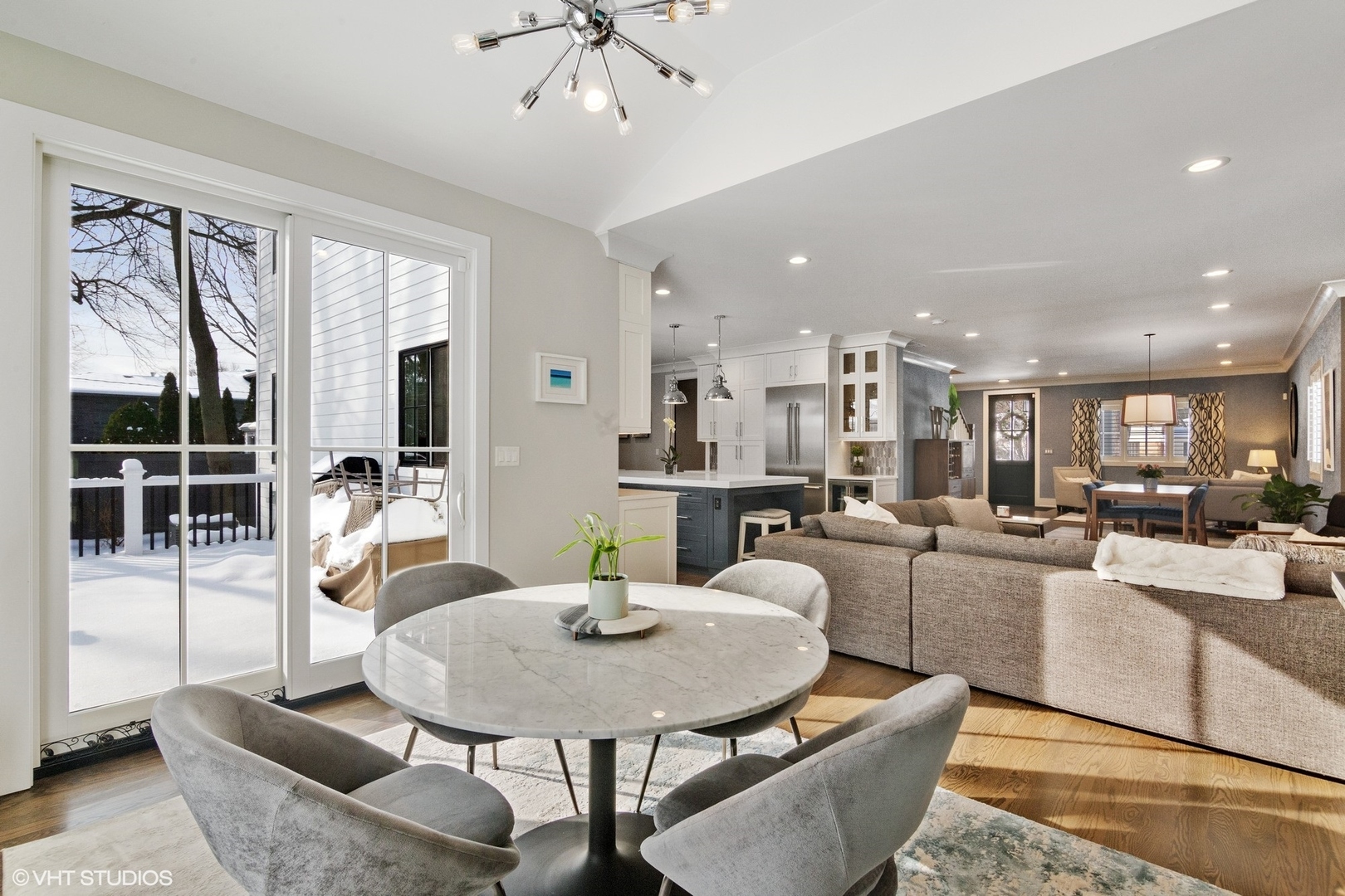 933 Echo Lane Glenview, IL 60025 - Photo 13 of 28 a living room with furniture a dining table and glass windows