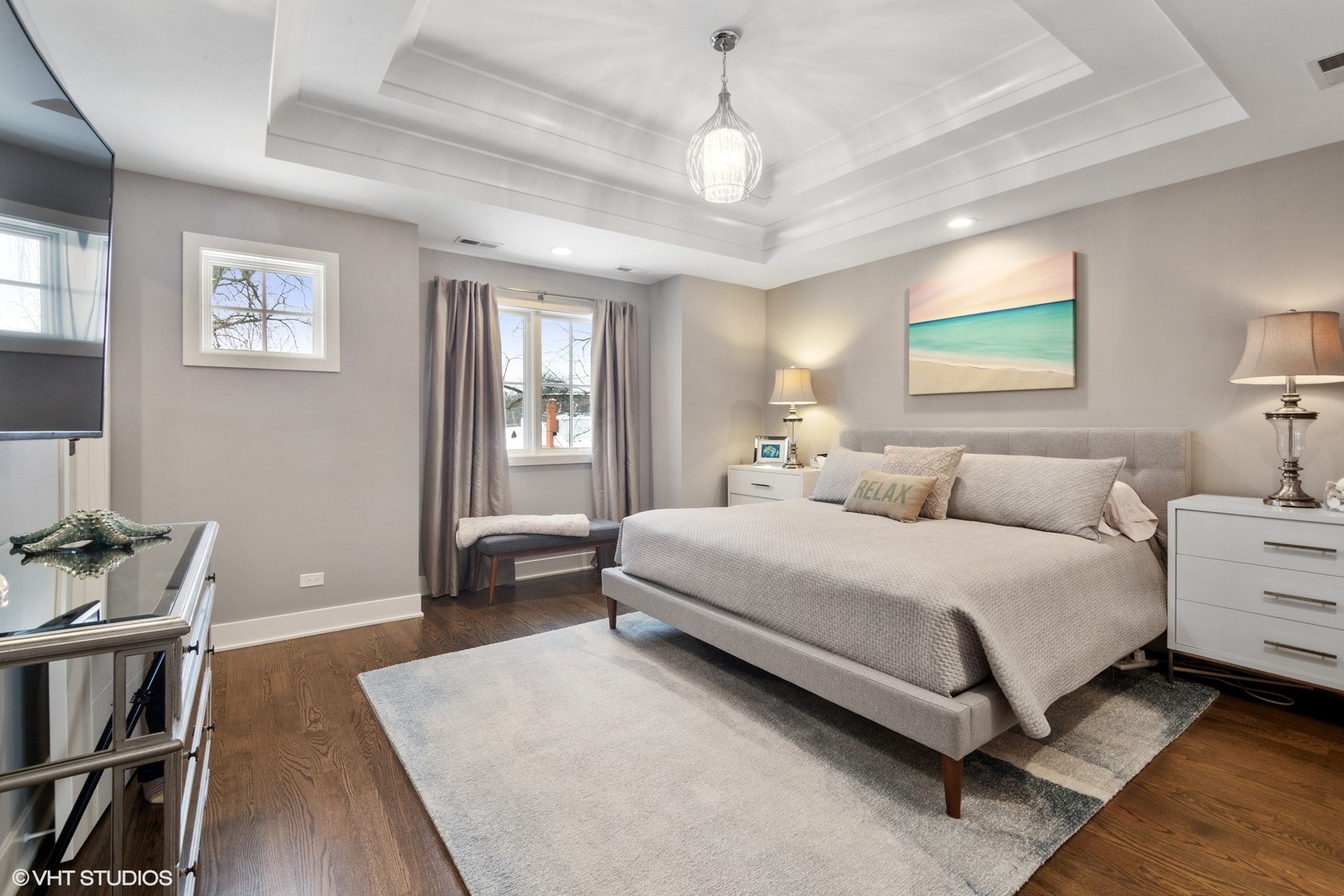 933 Echo Lane Glenview, IL 60025 - Photo 15 of 28 a spacious bedroom with a bed and dresser with wooden floor