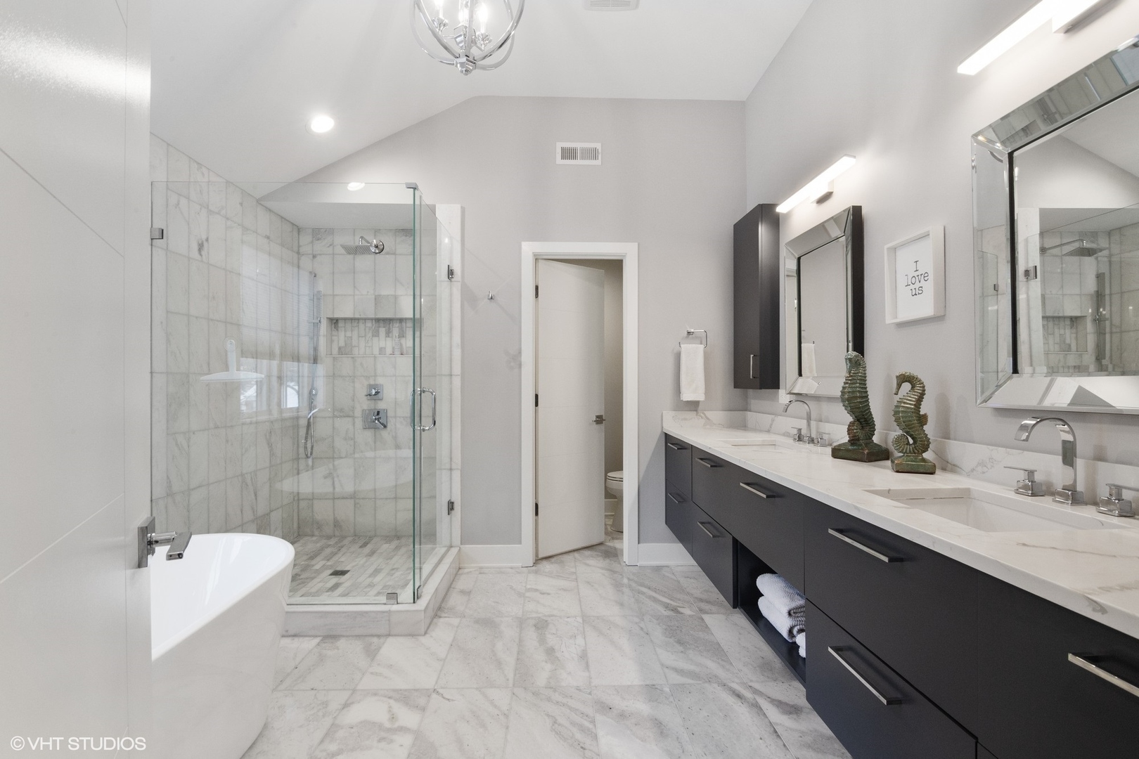 933 Echo Lane Glenview, IL 60025 - Photo 16 of 28 a bathroom with a double vanity sink toilet and shower