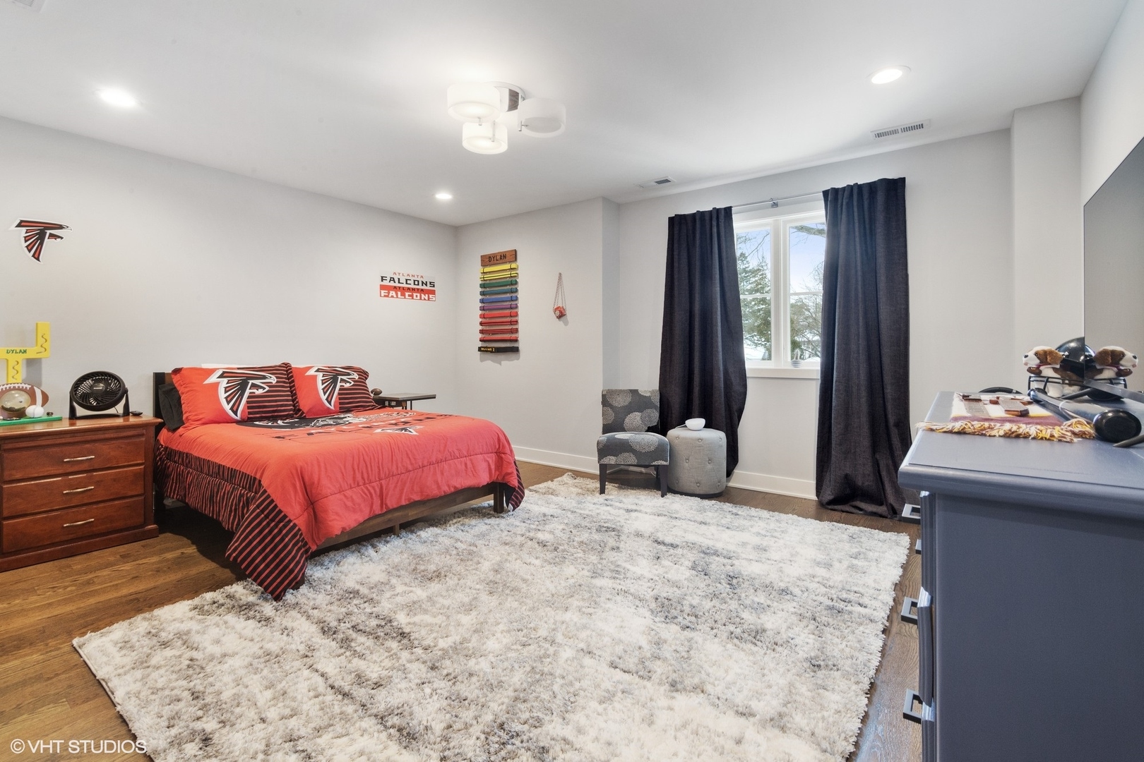 933 Echo Lane Glenview, IL 60025 - Photo 17 of 28 a bedroom with a bed and a dresser with mirror