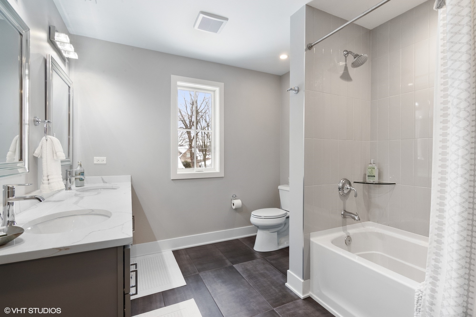 933 Echo Lane Glenview, IL 60025 - Photo 18 of 28 a bathroom with a sink a toilet and shower