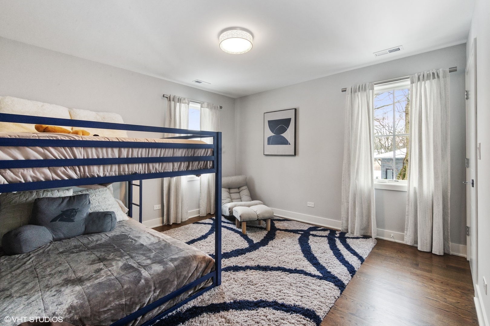 933 Echo Lane Glenview, IL 60025 - Photo 19 of 28 a bedroom with a bed and a window