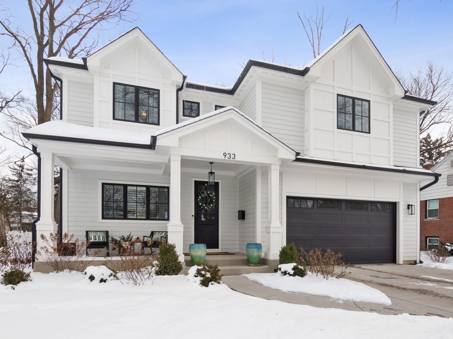 933 Echo Lane Glenview, IL 60025 - Photo 2 of 28 a front view of a house with yard and parking