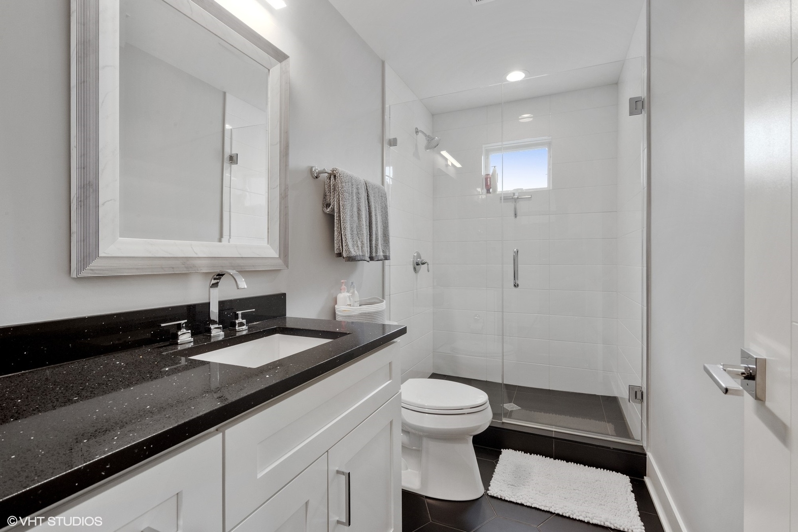 933 Echo Lane Glenview, IL 60025 - Photo 22 of 28 a bathroom with a granite countertop sink toilet and shower
