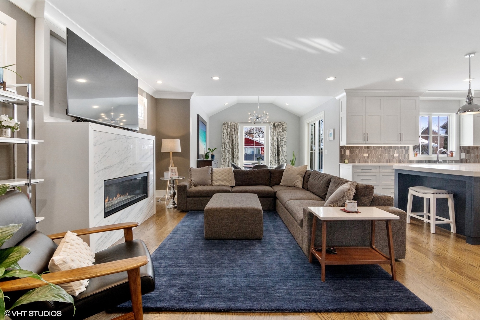 933 Echo Lane Glenview, IL 60025 - Photo 6 of 28 a living room with furniture a fireplace and a table