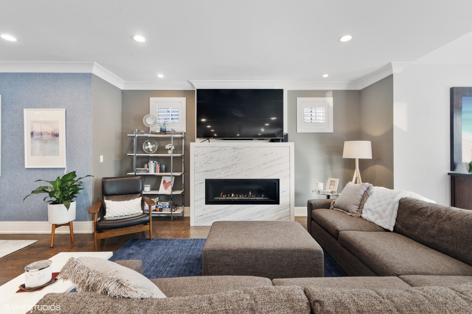 933 Echo Lane Glenview, IL 60025 - Photo 7 of 28 a living room with furniture a flat screen tv and a fireplace