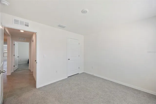 an empty room with a bathroom