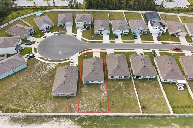 an aerial view of a house with swimming pool