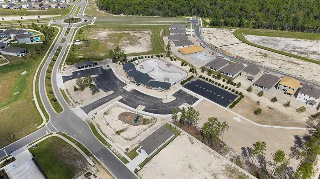 an aerial view of a house with outdoor space