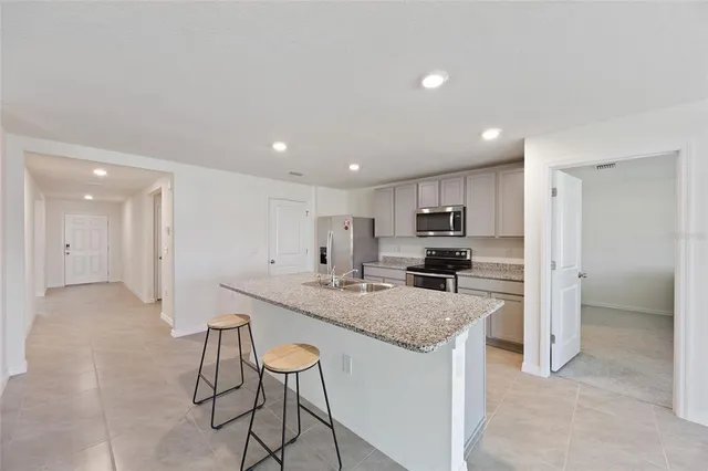 a kitchen with a counter top space cabinets and stainless steel appliances