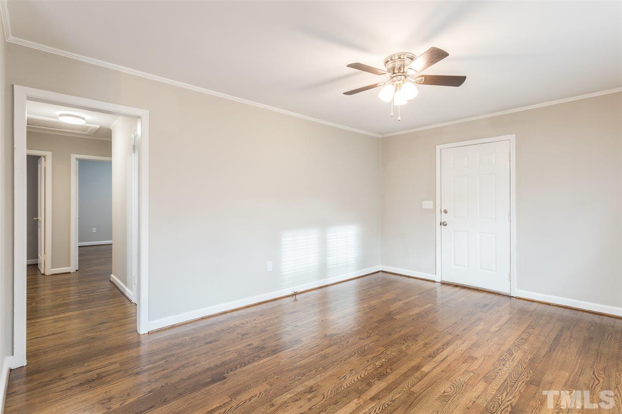 2732 Knowles Street Raleigh, NC 27603 - Photo 4 of 26 a view of an empty room with wooden floor