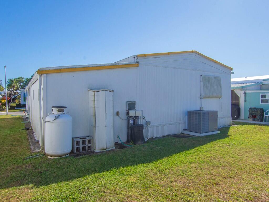 4800 Southeast Federal Highway, Unit 93 Stuart, FL 34997 - Photo 23 of 25 a view of a house with backyard and a garden