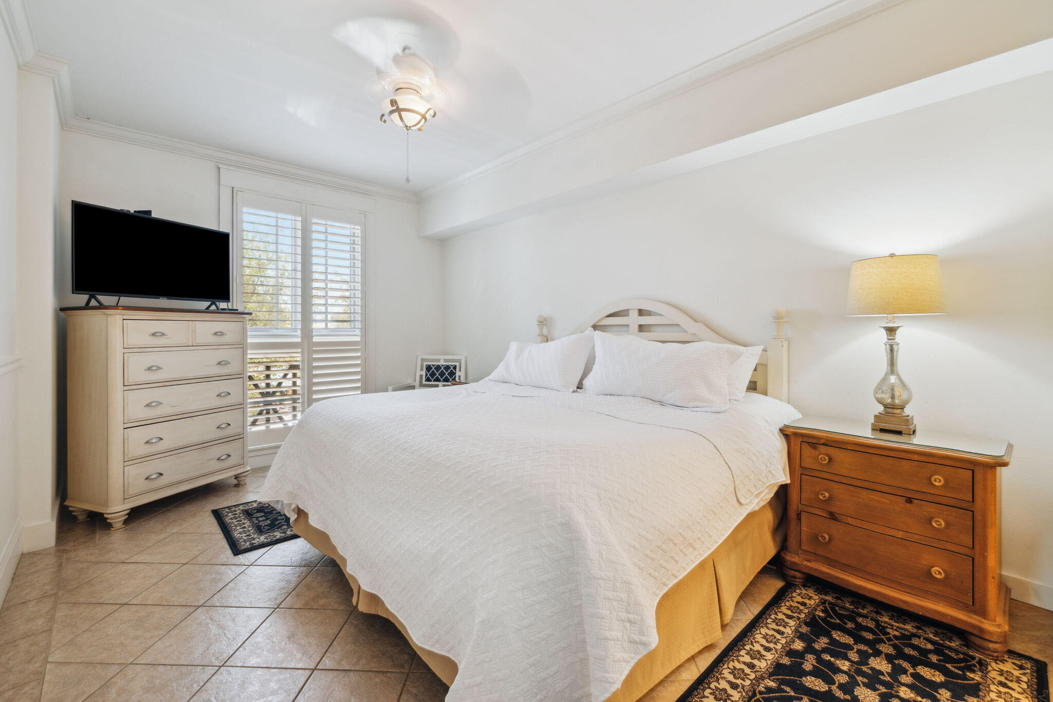 9100 Baytowne Wharf Boulevard, Unit 3668 Miramar Beach, FL 32550 - Photo 19 of 38 a bedroom with a bed and flat screen tv