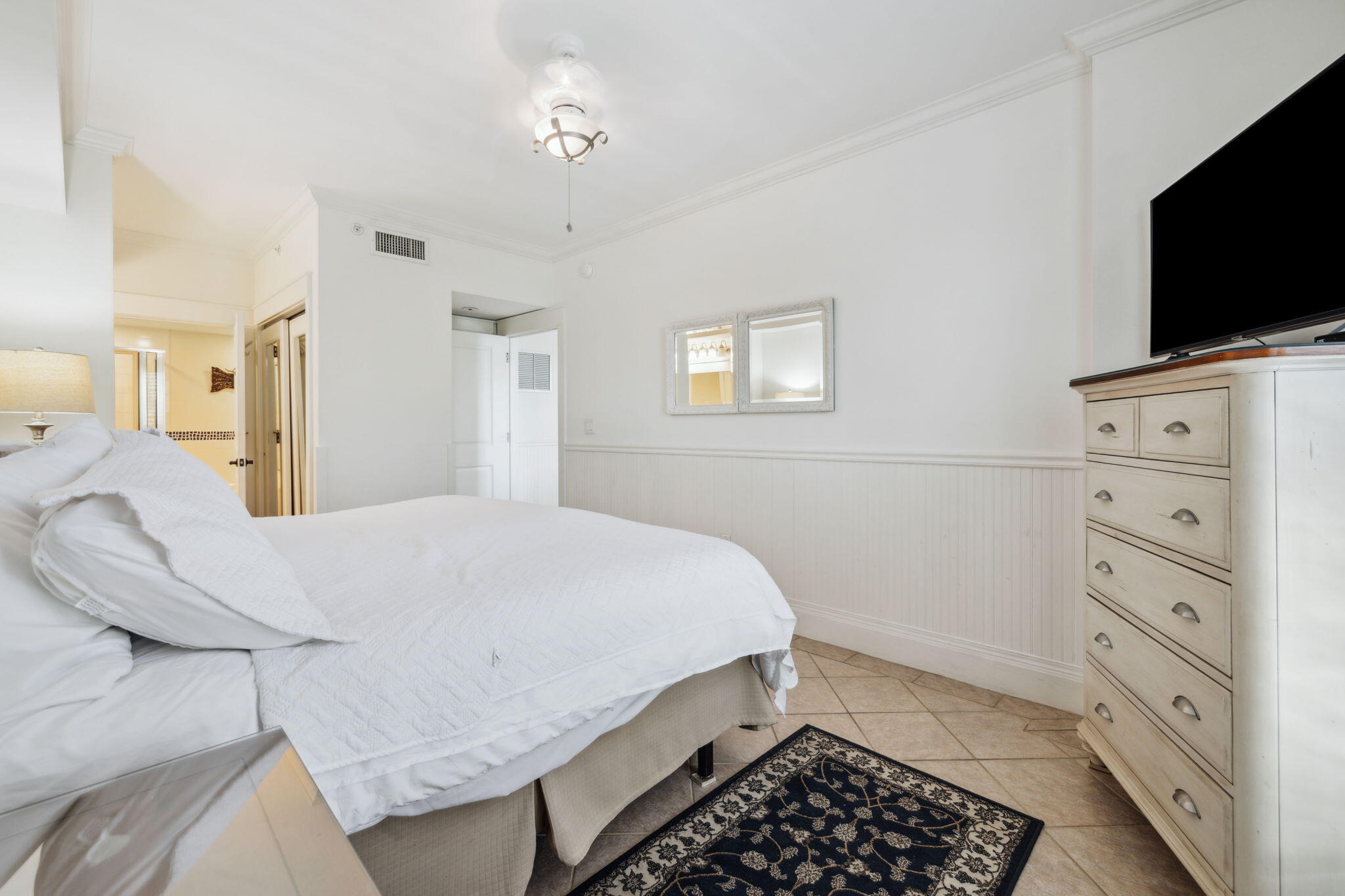 9100 Baytowne Wharf Boulevard, Unit 3668 Miramar Beach, FL 32550 - Photo 20 of 38 a bedroom with a bed and a flat screen tv