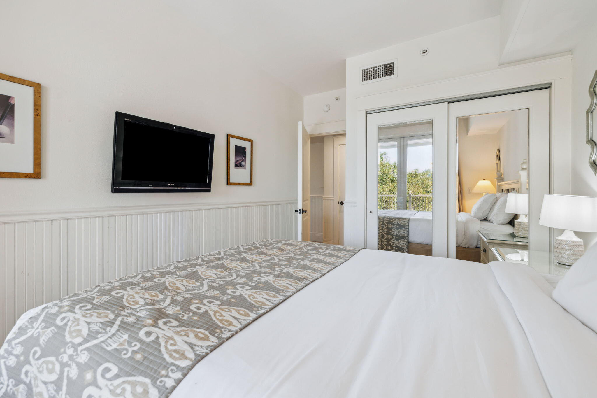 9100 Baytowne Wharf Boulevard, Unit 3668 Miramar Beach, FL 32550 - Photo 24 of 38 a bedroom with a bed and a flat screen tv