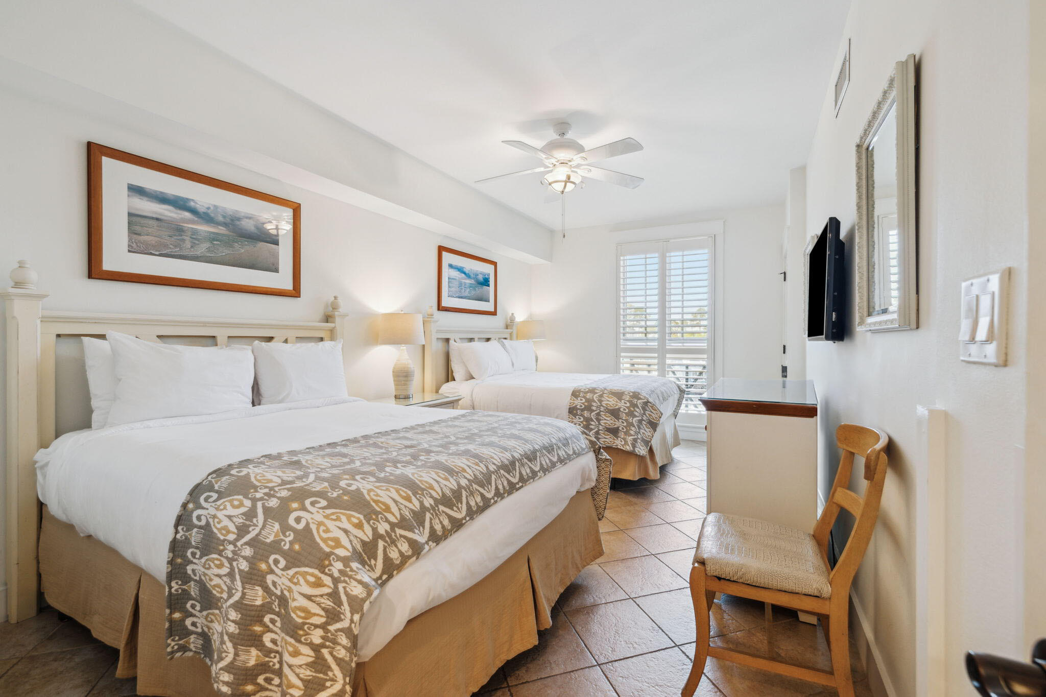 9100 Baytowne Wharf Boulevard, Unit 3668 Miramar Beach, FL 32550 - Photo 27 of 38 a bedroom with a bed and a chandelier