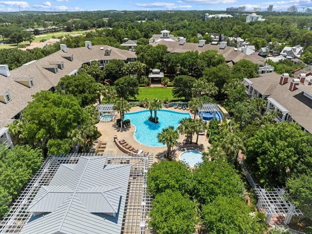 an aerial view of residential houses with outdoor space and river view