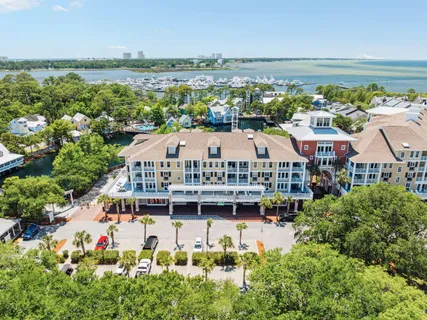 a view of a house with outdoor space and a lake view in back