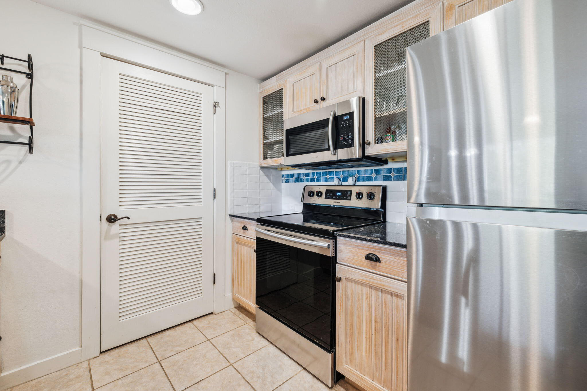 9100 Baytowne Wharf Boulevard, Unit 3668 Miramar Beach, FL 32550 - Photo 7 of 38 a kitchen with stainless steel appliances a stove microwave and a refrigerator
