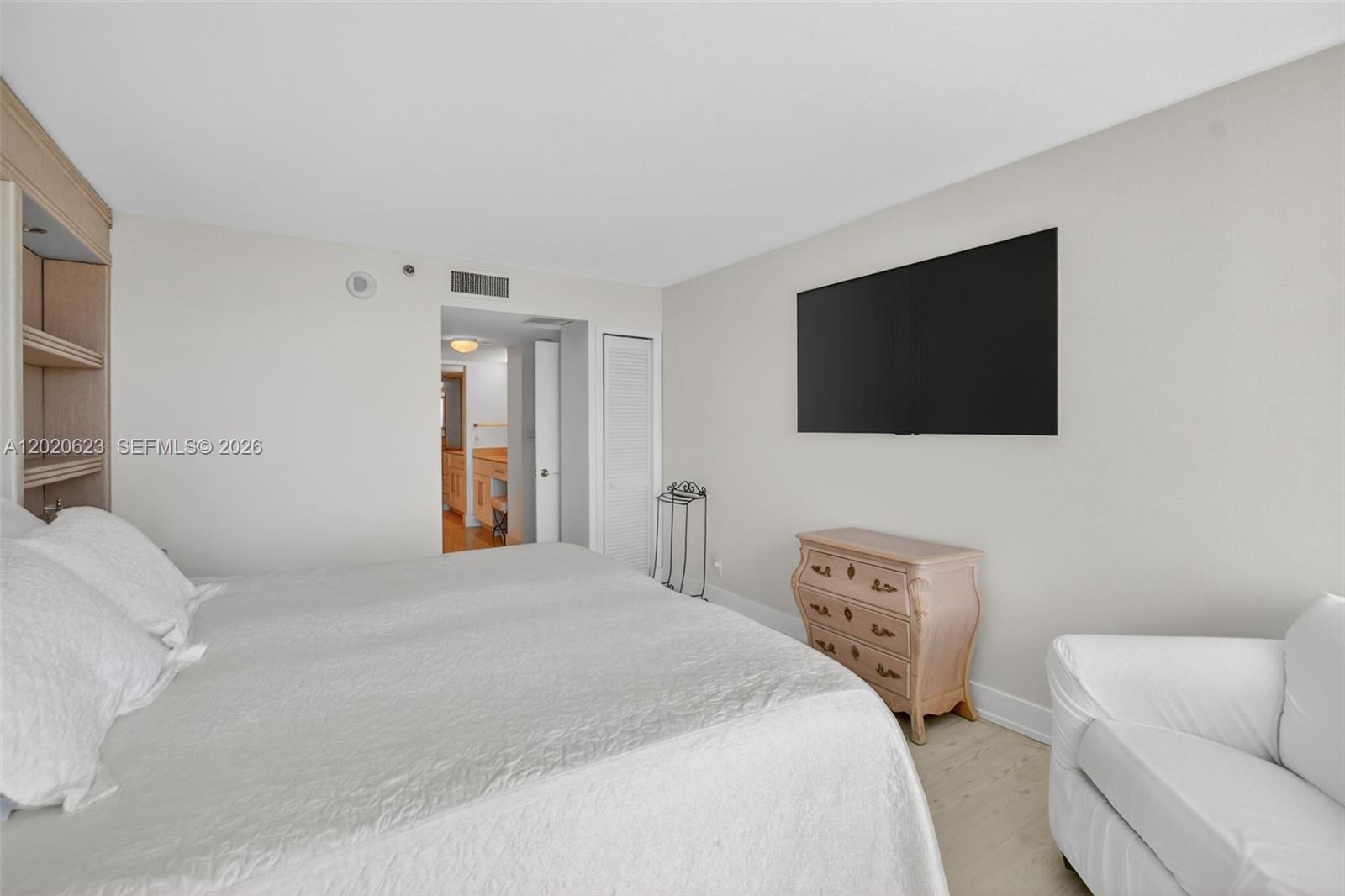 4101 North Ocean Boulevard, Unit 1605 Boca Raton, FL 33431 - Photo 23 of 35 a bedroom with a bed and a flat screen tv