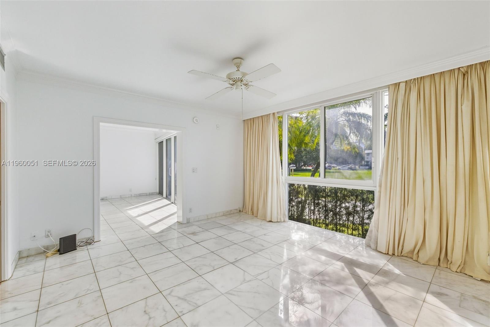 1 Harbour Way, Unit 108 Bal Harbour, FL 33154 - Photo 13 of 27 a view of empty room with wooden floor and fan