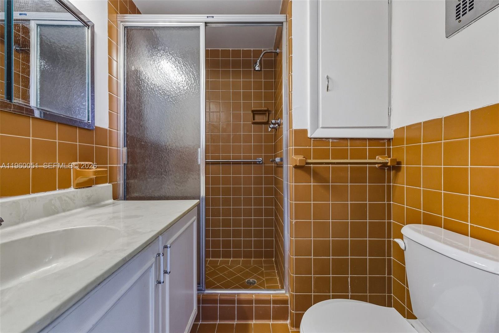 1 Harbour Way, Unit 108 Bal Harbour, FL 33154 - Photo 20 of 27 a bathroom with a sink toilet and shower
